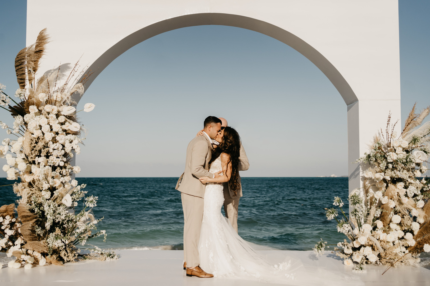 Bride and groom during a beachfront wedding ceremony in Riviera Maya